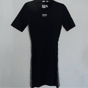 Short black Adidas dress with the Adidas logo along the sides
